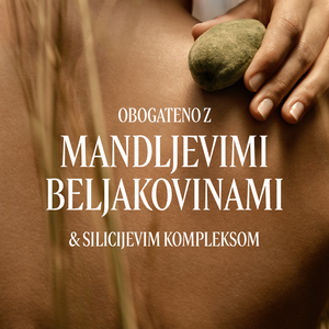 Roke, ki držijo mandljeve oreščke. Dodan je napis Amande Sublime - L'Occitane